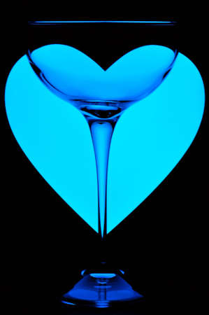 Glass with blue heart backgroundの写真素材