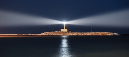 Lighthouse at night, double lightの写真素材