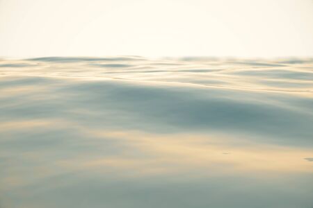Blue water background with ripples, sea, ocean wave low angle view. Close-up Nature background. Hard focus with selective focus. 3d renderingの写真素材