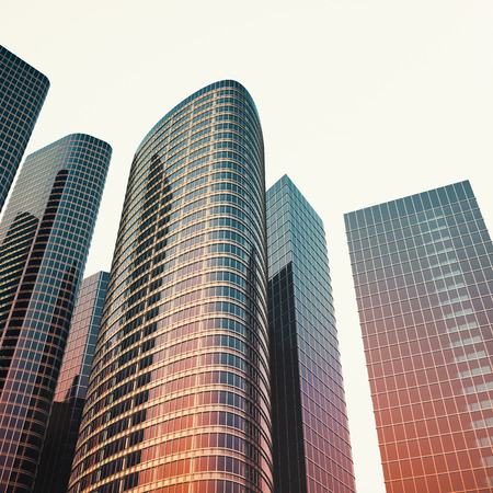 Bottom view of modern skyscrapers in business district in evening light at sunset. Industrial architecture, business construction and estate financial concept. 3d renderingの写真素材