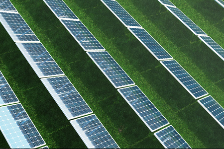 3D illustration Solar energy concept. Solar panels on grass. Blue sky reflection on photovoltaic panel. Power, ecology, technology, electricity.の写真素材