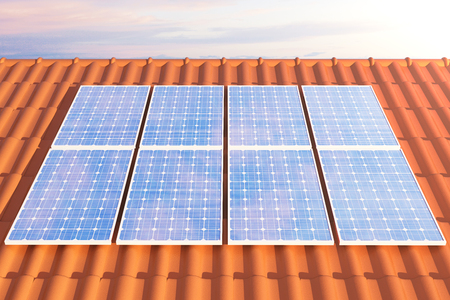 3D illustration solar panels on a red roff, power generation technology. Alternative energy. Solar battery panel modules with scenic sunset with blue sky with sun light.の写真素材