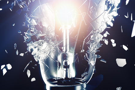 Exploding light bulb on a blue background, with concept creative thinking and innovative solutions. 3D renderingの写真素材