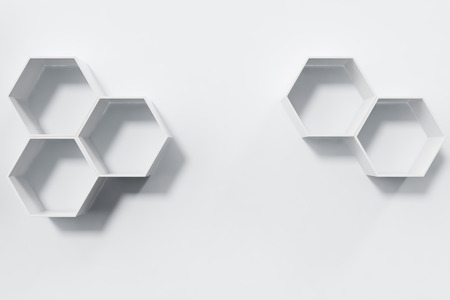 Empty white wall with hexagon shelves on the wall, 3D renderingの写真素材