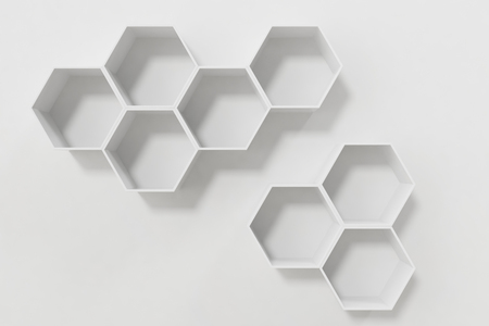 Empty white wall with hexagon shelves on the wall, 3D renderingの写真素材