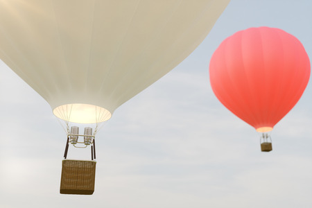3D illustration hot air balloon on sky background. White, red, blue, green and yellow air ballon flyes on skyの写真素材