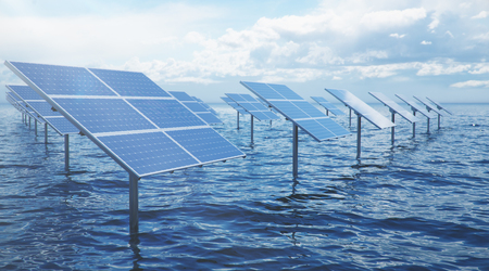 3D illustration solar panels in the sea or ocean. Alternative energy. Concept of renewable energy. Ecological, clean energy. Solar panels, photovoltaic with reflection beautiful blue sky.の写真素材