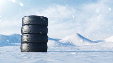 Winter tires on a background of snowstorm, snowfall and slippery winter road. Winter tires concept. Concept tyres, winter tread. Wheel replacement. Road safety. 3d illustration with falling snowの写真素材