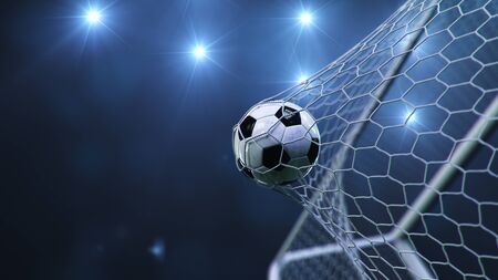 Soccer ball flew into the goal. Soccer ball bends the net, against the background of flashes of light. Soccer ball in goal net on blue background. A moment of delight. 3D illustrationの写真素材