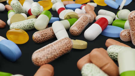 Many different colored tablets, capsules on black background. Health care concept. Antibiotics inside pills, vitamins. Goods from pharmacy. Pharmaceutical company, industry, 3d illustrationの写真素材
