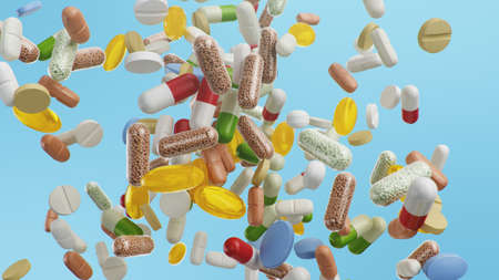 Flying, falling pills. different colored tablets, capsules. Health care concept. Antibiotics inside...