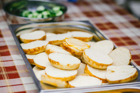 Slices of cheese in the form of hearts on a trayの写真素材
