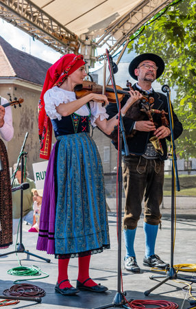 Straznice, Czech Republic - June 25, 2022 International Folklore Festival. Bagpiper and violinist on stage in Strazniceのeditorial素材