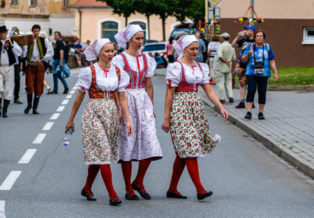 Straznice, Czech Republic - June 25, 2022 International Folklore Festival Three girls in folk...