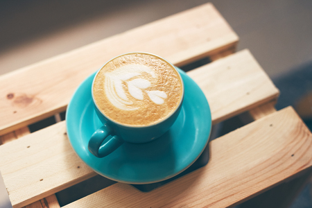 Coffee cup of cappuccino with heart signの写真素材