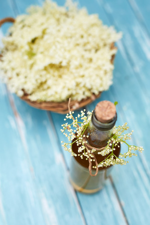 Top view of homemade elderflower syrup in a bottleの写真素材