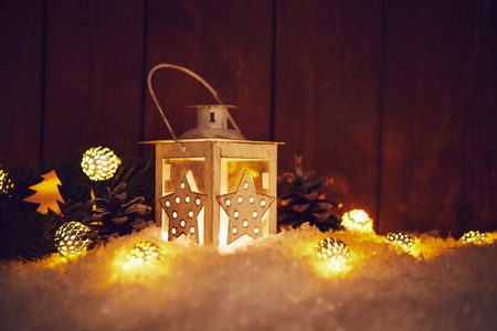 Christmas lantern with shining baubles and pine conesの写真素材