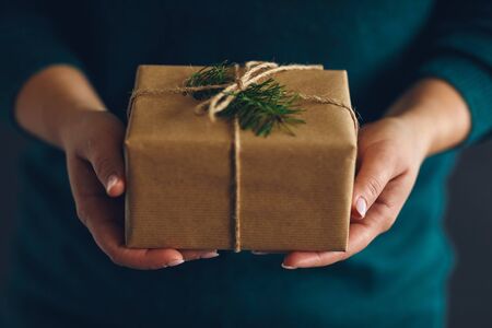 Woman holding wrapped Christmas present