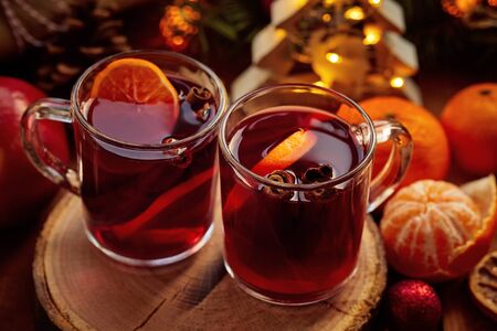 Top view of two glasses of hot mulled wine on christmas tableの写真素材