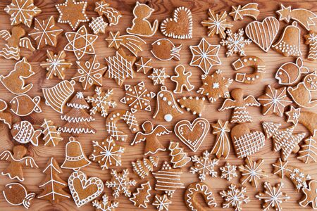 Flat lay Christmas wooden table with homemade gingerbread cookiesの写真素材