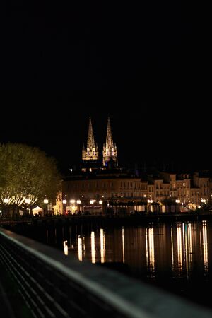 Night view of the right bank of the Garonne Riverand Eglise Saint-Louis des Chartrons,  Bordeaux, Franceの写真素材