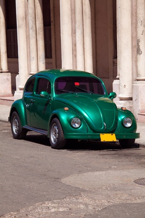 Vintage green car on the street of old city, Havana, Cubaの写真素材