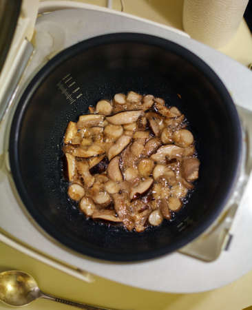 Sliced and Roasted Forest Mushrooms in Multicookerの写真素材