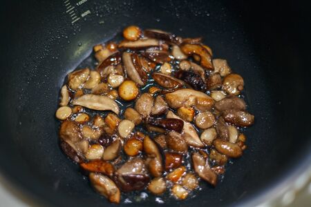 Sliced and Roasted Forest Mushrooms in Multicookerの写真素材