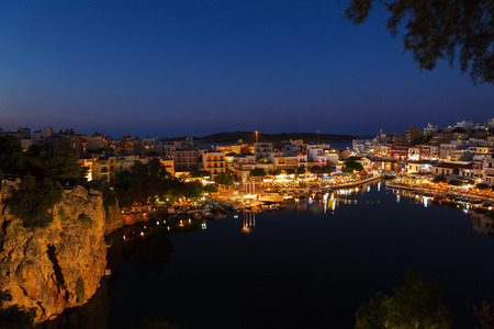 Agios Nikolaos City and Voulismeni Lake at Night  Crete, Greeceの写真素材