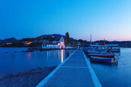 Evening scene of Vlacherna monastery and Pontikonisi island, Kanoni, Corfu, Greeceの写真素材