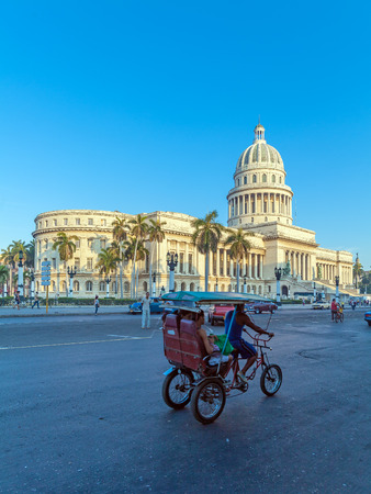 HAVANA, CUBA - APRIL 2, 2012: Taxi bicycle at streets of old city near Capitolioのeditorial素材