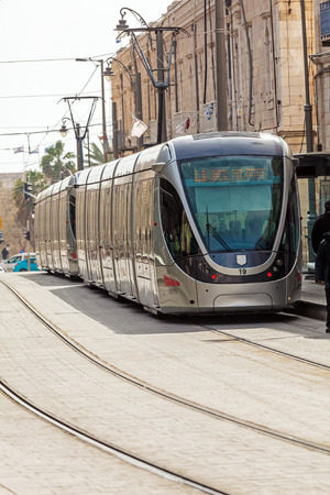 JERUSALEM, ISRAEL - FEBRUARY 15, 2013: People using modern rapid tram in  city centerのeditorial素材