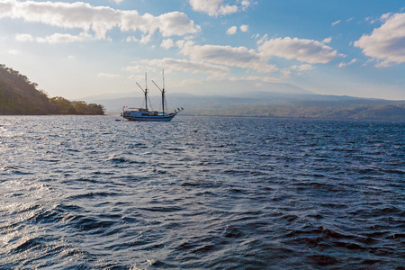 Traditional Vintage Small Boat in Ocean, Komodo, Indonesiaの写真素材