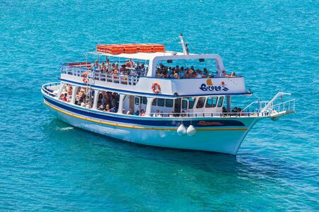 AGIOS NIKOLAOS, GREECE - JULY 31, 2012:  Cruise boat with tourists during trip to Spinalonga island