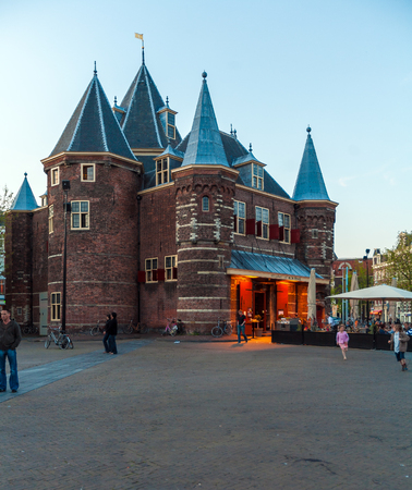 AMSTERDAM, NETHERLANDS - APRIL 4, 2008: Tourists eat at a cafe in the building ofThe Waag (weigh house) on Nieuwmarkt squareのeditorial素材