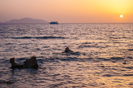 Beautiful white yacht in Red sea with sunset, Sharm el Sheikh, Egyptの写真素材