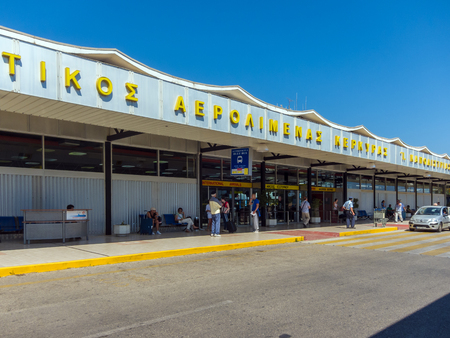 CORFU, GREECE - JUNE 30, 2011:  Tourists stand near the entrance to the airport of Corfu cityのeditorial素材