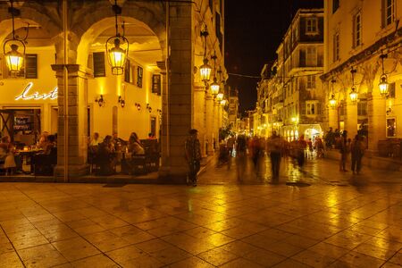 CORFU, GREECE - JULY 12, 2011: Lively night life on the main pedestrian street Liston after sunsetのeditorial素材