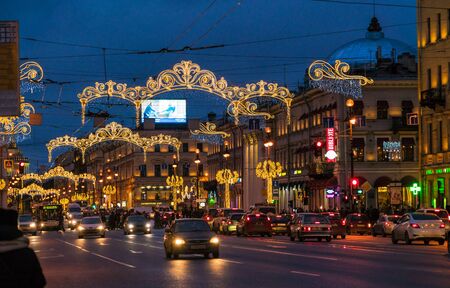 SAINT PETERSBURG, RUSSIA - DECEMBER 25, 2016:  Busy automobile traffic on Nevsky prospect with Christmas lightsのeditorial素材