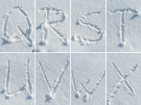 English hand-written alphabet in the snow - a complete font set of letters, numbers and punctuationの写真素材