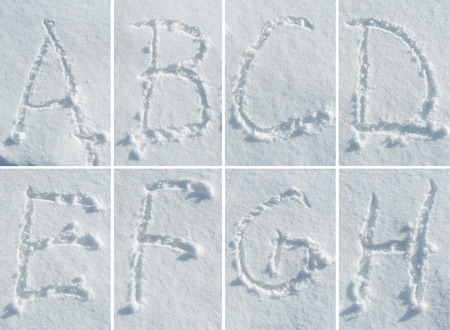 English hand-written alphabet in the snow - a complete font set of letters, numbers and punctuationの写真素材