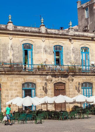 HAVANA, CUBA - APRIL 2, 2012: Tourist walking near El Patio Restaurant in the Cathedral Squareのeditorial素材