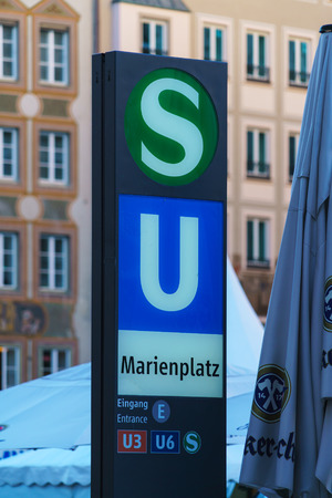Munich, Germany - October 14, 2017: A pointer to a metro station and the city tram to Marienplatzのeditorial素材