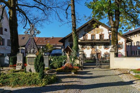 Obberamergau, Germany - October 15, 2017: Traditional homes with Luftlmalerei frescoes  and touristsのeditorial素材