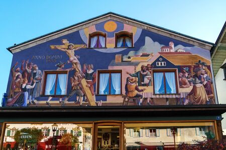 Obberamergau, Germany - October 15, 2017: Traditional homes with Luftlmalerei frescoes  and touristsのeditorial素材