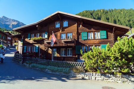 Murren, Switzerland - October 17, 2017: Traditional Chalet house and Alps mountains in Berner Oberland villageのeditorial素材