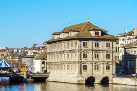 Zurich, Switzerland - October 16, 2017: Tourists walk along the bridge and the embankment of the Limmet Riverのeditorial素材