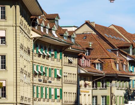Bern, Switzerland - October 17, 2017: Tourists and locals on the streets of the old city surrounded by traditional houses and shopsのeditorial素材