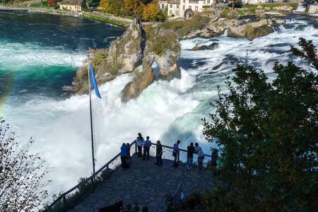 Neuhausen, Switzerland - October 16, 2017: Tourists watch the Rhine waterfall from the site of the laufen castleのeditorial素材