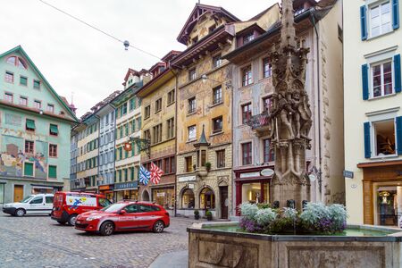 Lucerne, Switzerland - October 19, 2017: Traditional frescoed homes and fountains in old city